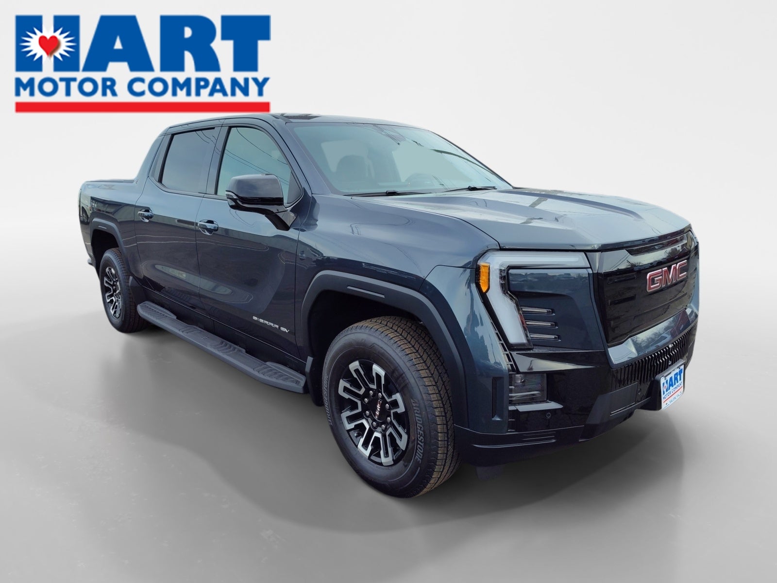 2026 GMC Sierra EV Elevation Extended Range in Deep Ocean Metallic — front three-quarter view